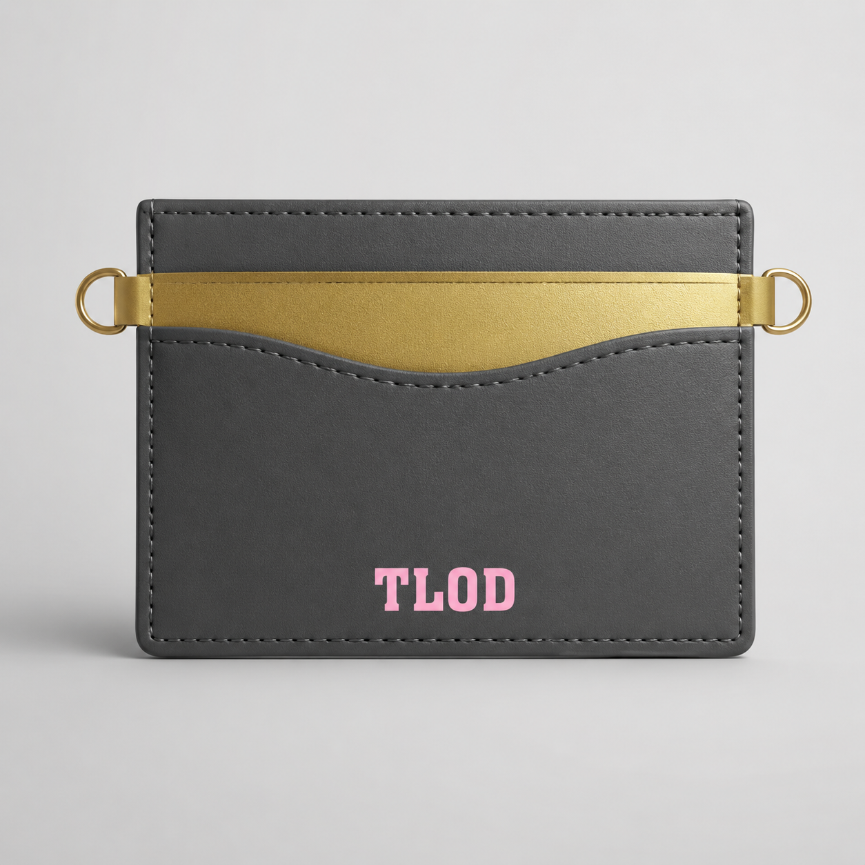 Gray cardholder with gold accent and 'TLOD' branding on a gray background